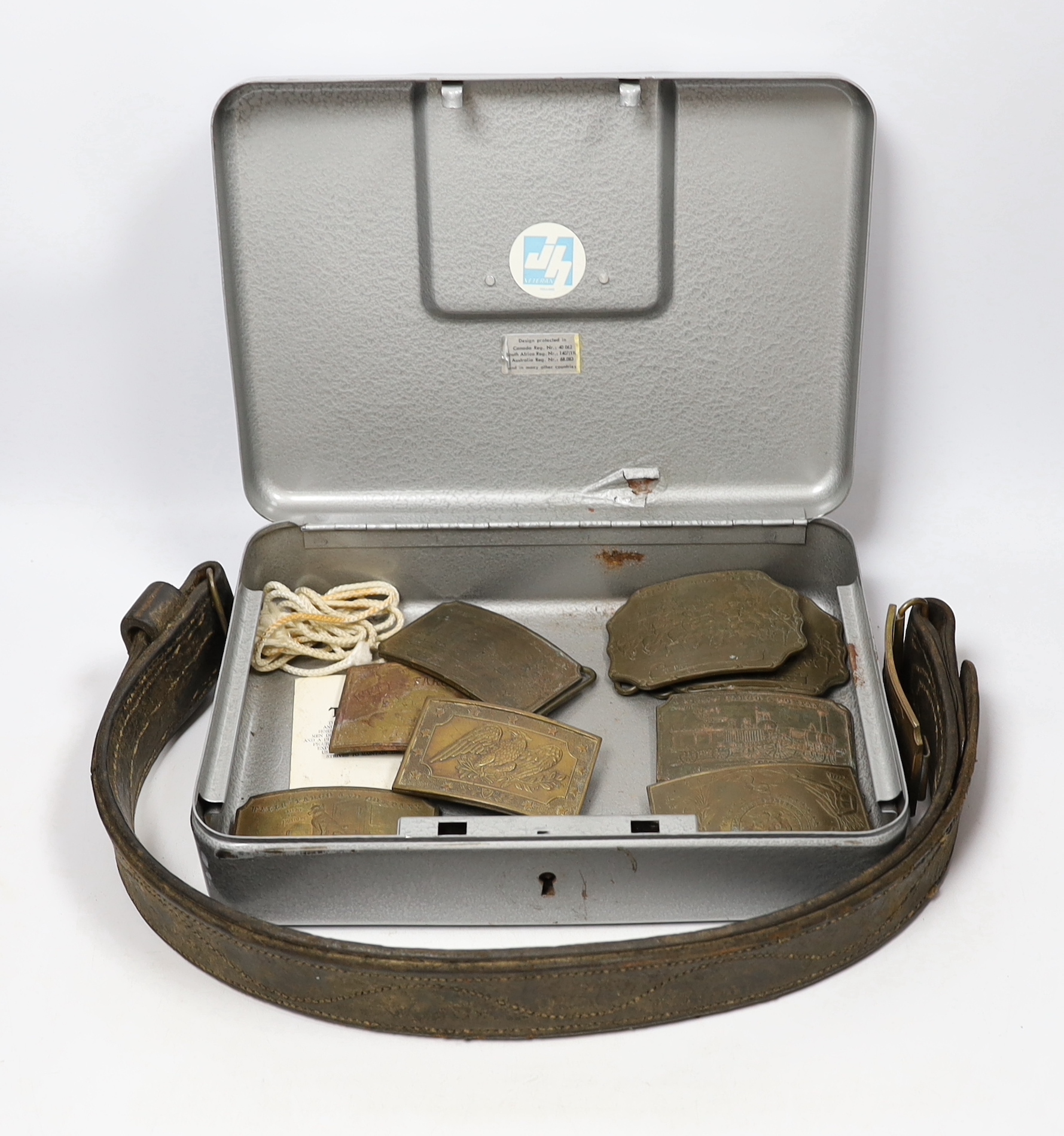 A collection of Wells Fargo and similar belt buckles by Tiffany & Co. Etc.